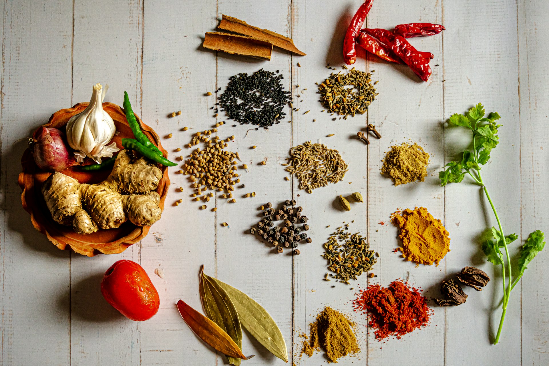 Whole spices resting on handmade paper